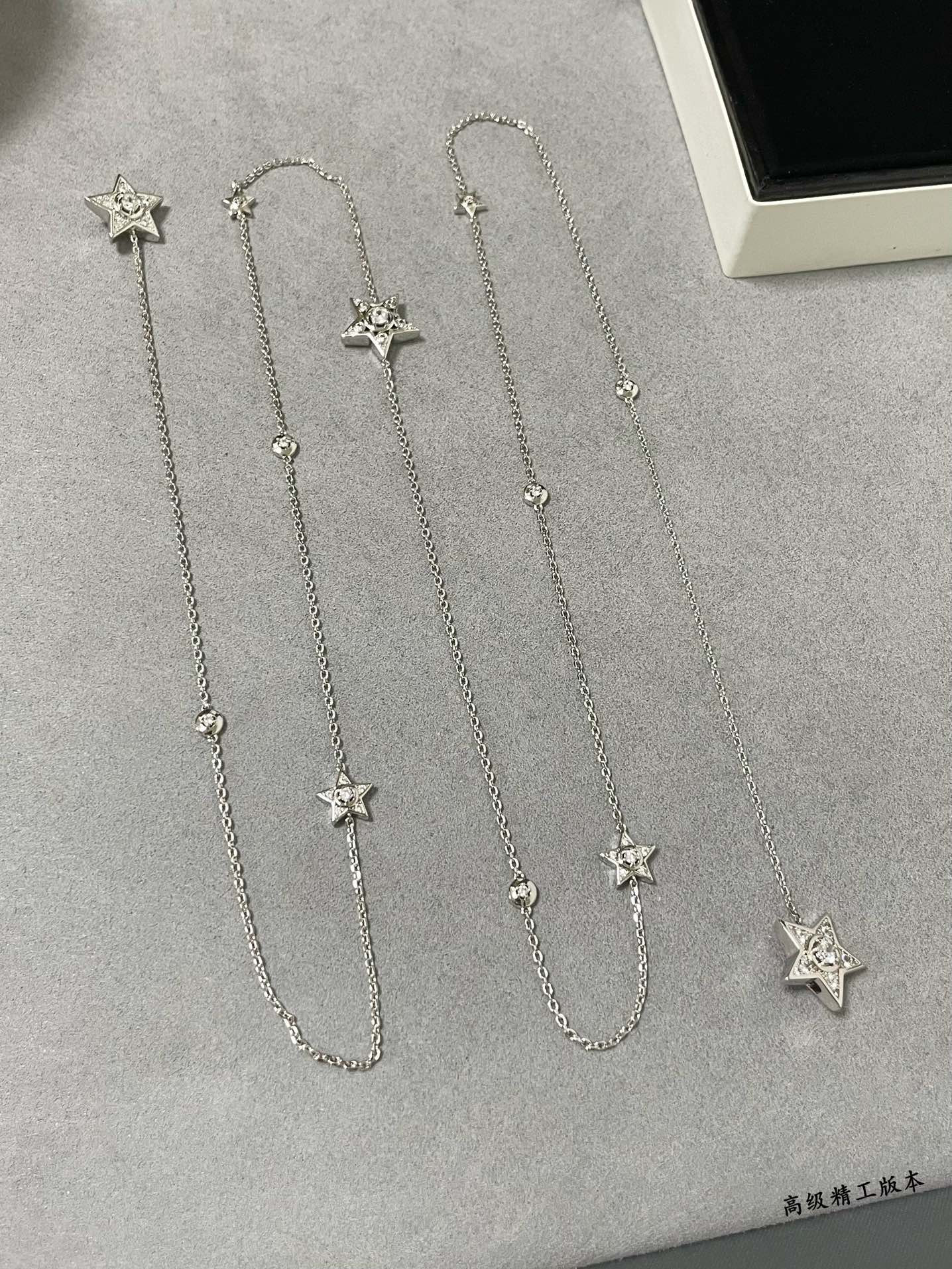 Ch*el star sweater necklace