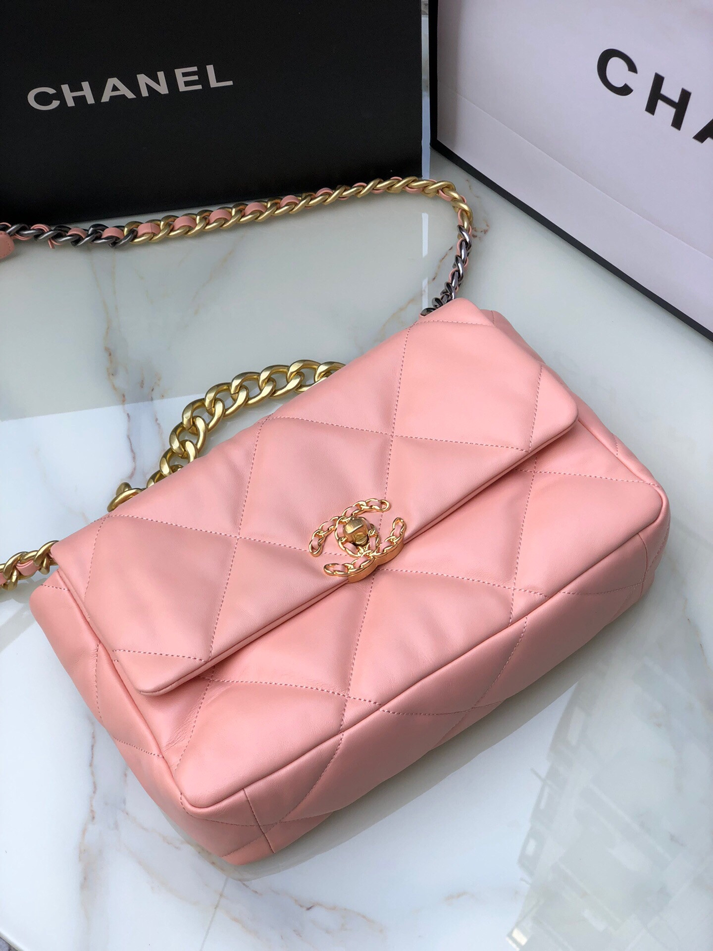 Ch*el 19 large handbag shiny leather, gold-tone, silver-tone & ruthenium-finish metal light pink 7.8 × 11.7 × 3.9 in